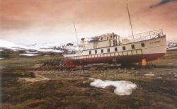 Fishing boat at low tide