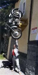 Sue Salvadori and a motorcycle mounted on wall